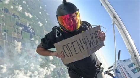 Fort Lauderdale man sky dives with ‘Open 4 work’ sign, lands new job